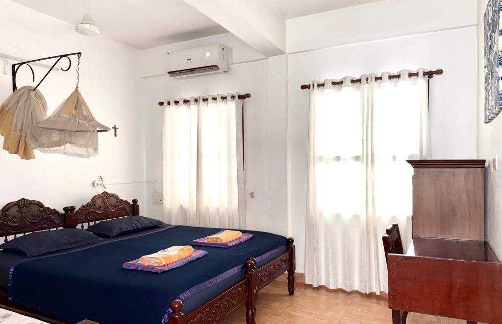 Postel nebo postele na pokoji v ubytování Reds Residency - Homestay