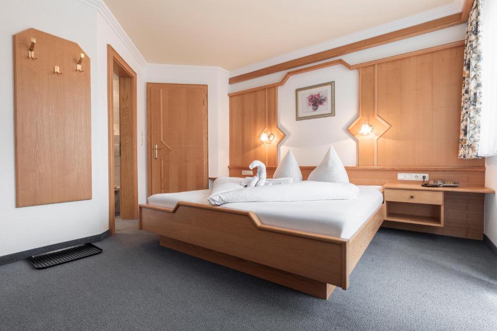 Posteľ alebo postele v izbe v ubytovaní SCHMID Rooms & Apartments