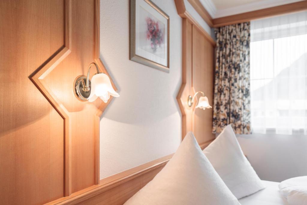 Posteľ alebo postele v izbe v ubytovaní SCHMID Rooms & Apartments
