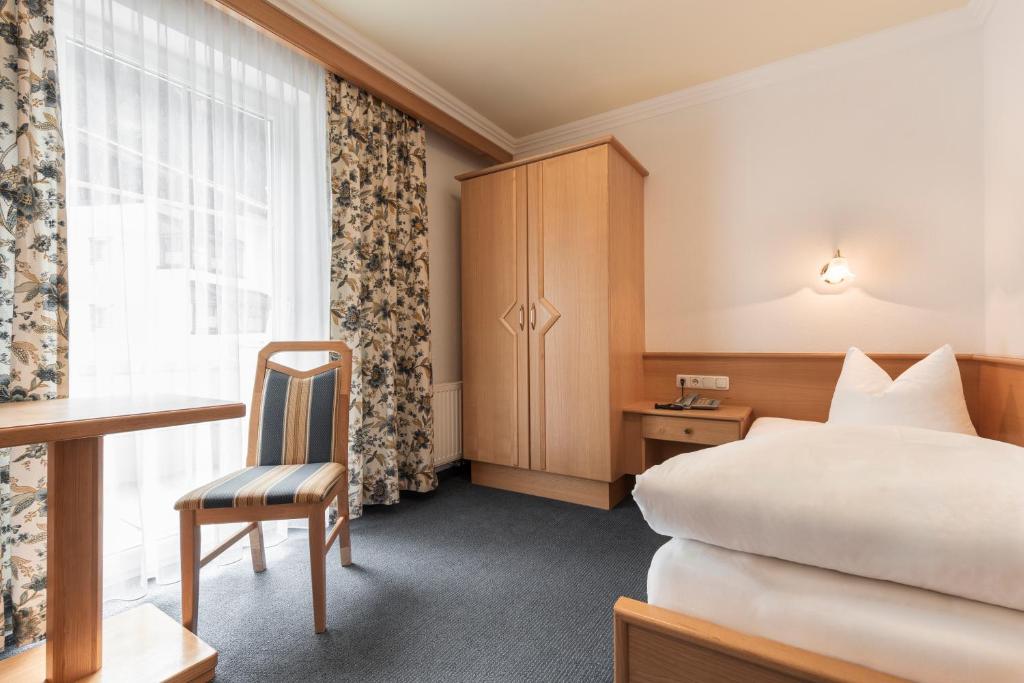 Posteľ alebo postele v izbe v ubytovaní SCHMID Rooms & Apartments