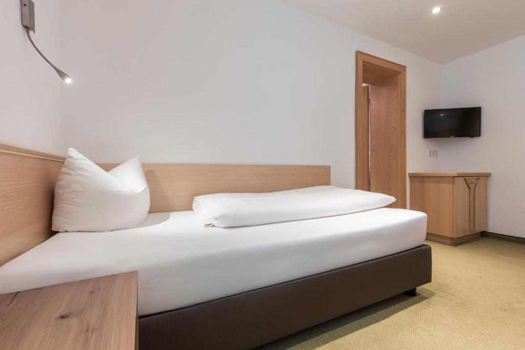 Posteľ alebo postele v izbe v ubytovaní SCHMID Rooms & Apartments