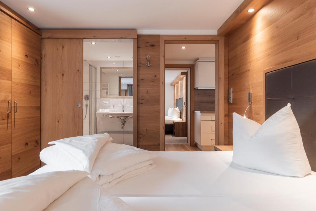 Posteľ alebo postele v izbe v ubytovaní SCHMID Rooms & Apartments