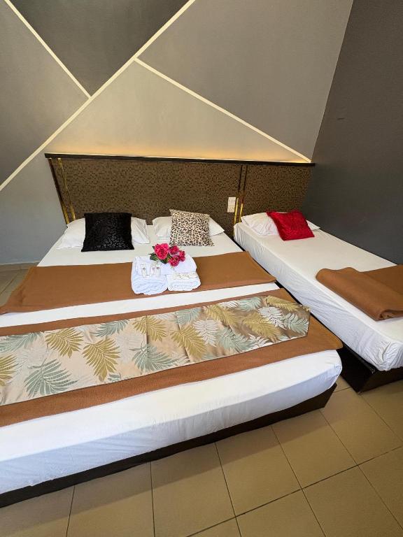 Postel nebo postele na pokoji v ubytování Weng Kong Hotel