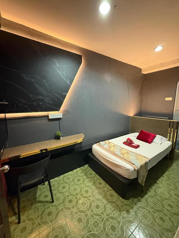 Postel nebo postele na pokoji v ubytování Weng Kong Hotel