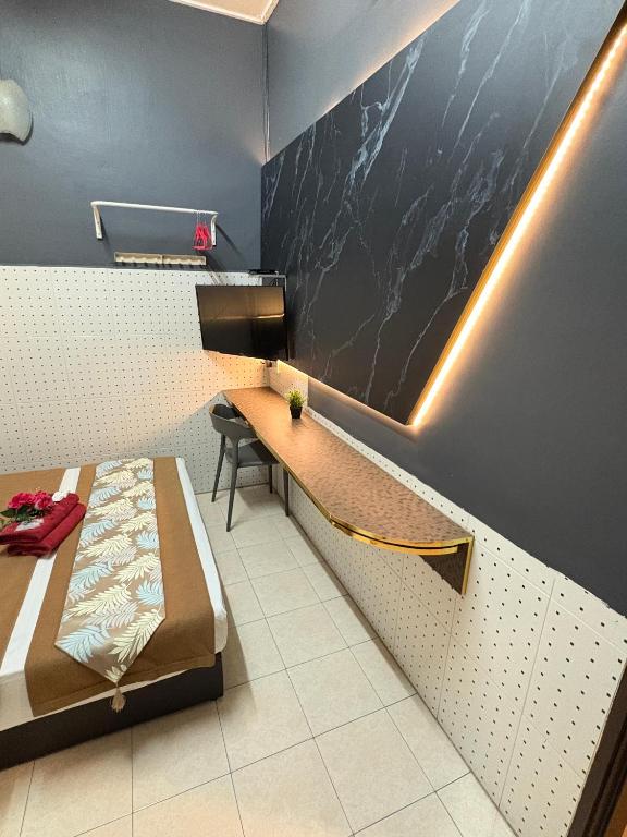 Postel nebo postele na pokoji v ubytování Weng Kong Hotel