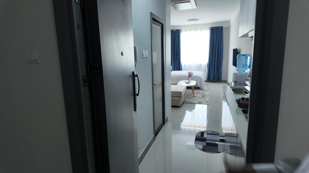 a white living room with a white couch and a living room at Cozy homes sabaki in Nairobi