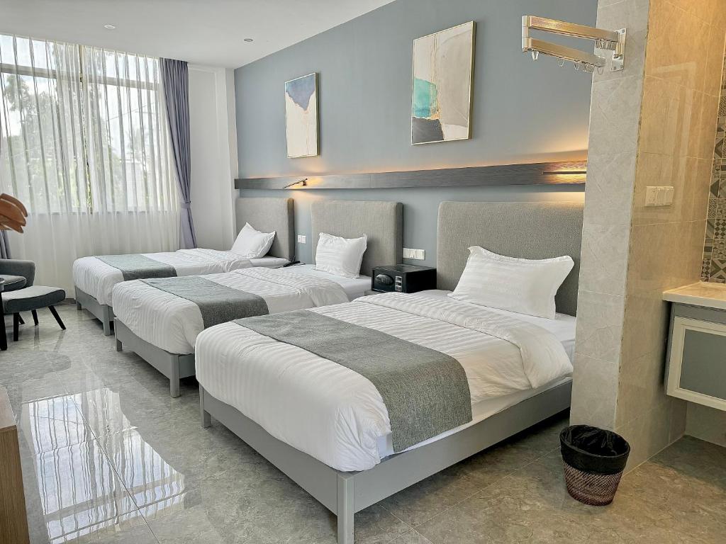 Postel nebo postele na pokoji v ubytování Bohol Panglao Begonia Resort