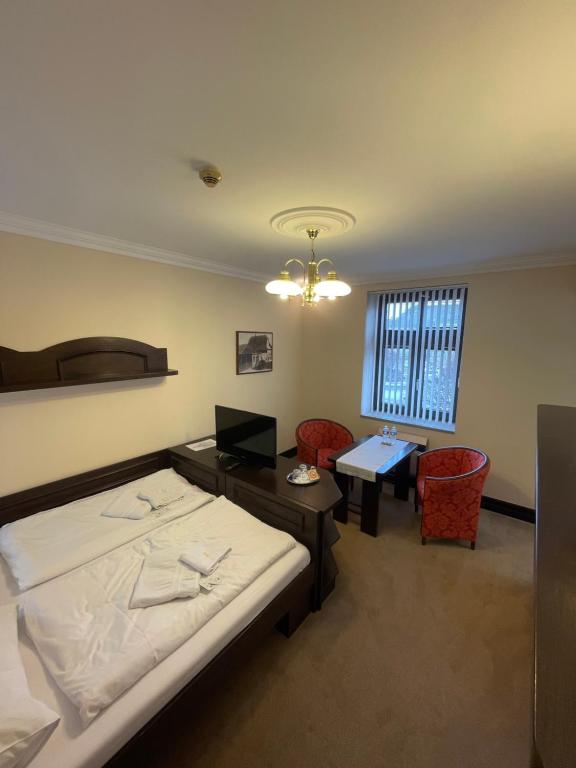 Postel nebo postele na pokoji v ubytování Hotel Bravo