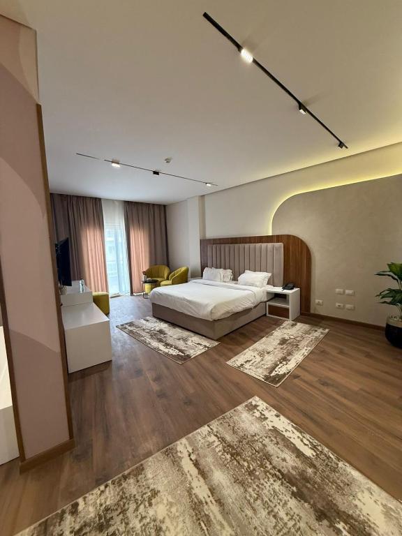 Postel nebo postele na pokoji v ubytování Tolip Family Park Hotel