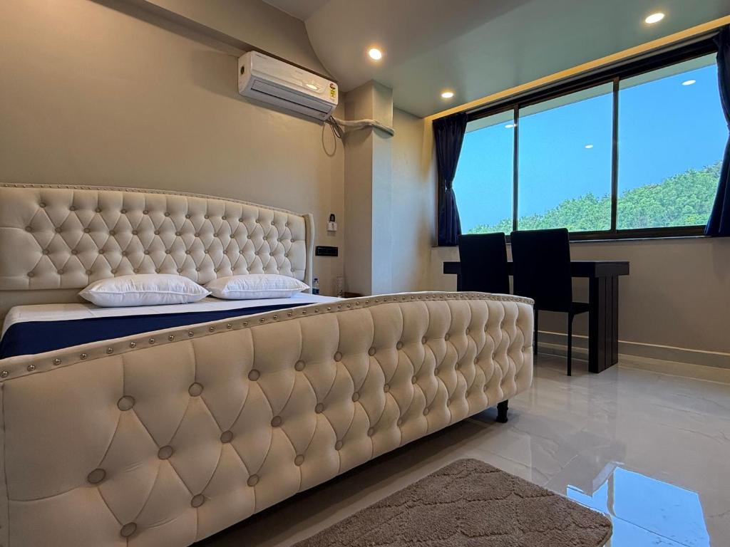 Postel nebo postele na pokoji v ubytování Elite Residency