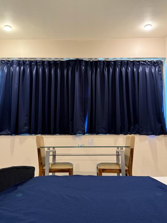 Postel nebo postele na pokoji v ubytování Elite Residency