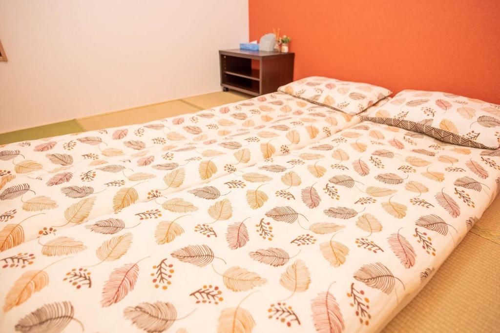 Postel nebo postele na pokoji v ubytování 源隐の宿