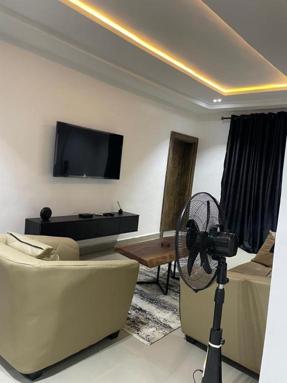 TV a/nebo společenská místnost v ubytování Accommodation Guru
