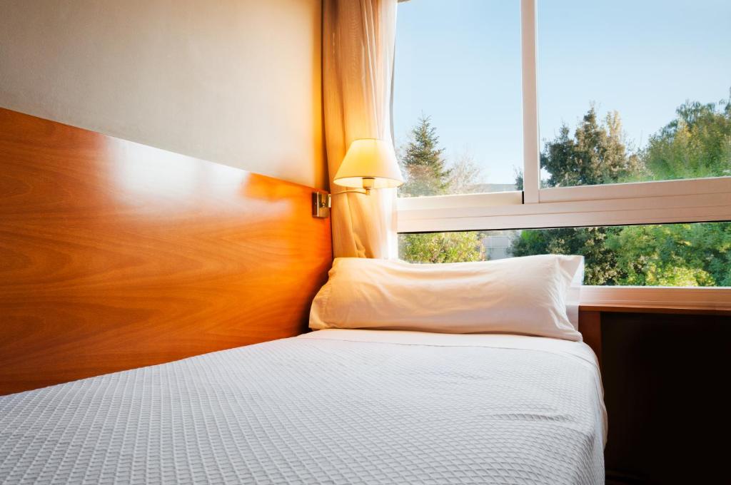Postel nebo postele na pokoji v ubytování PARK SEDO Aparthotel