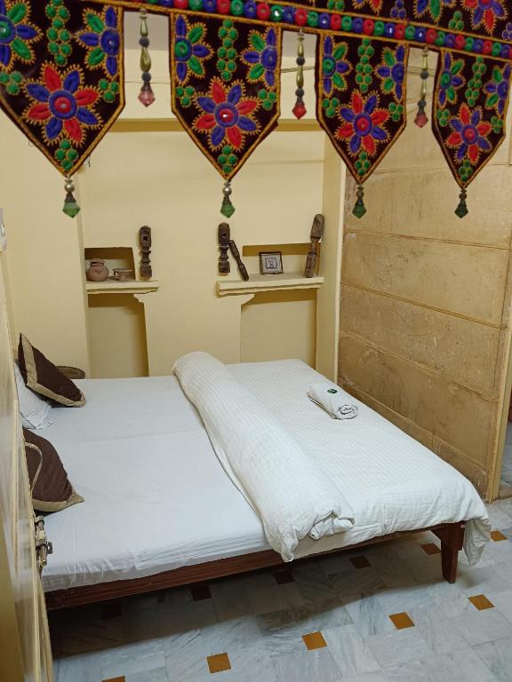 Postel nebo postele na pokoji v ubytování Ideal Guest House