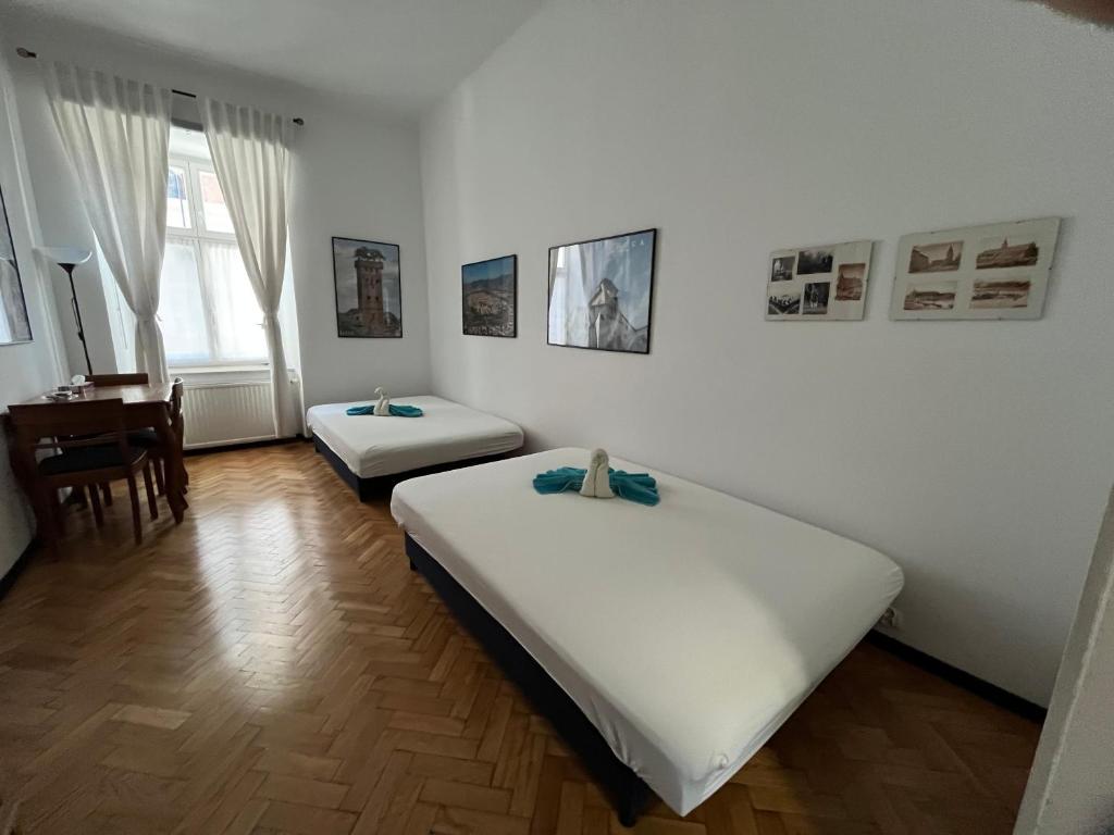 Posteľ alebo postele v izbe v ubytovaní Home in Krakow Silvio's Apartments