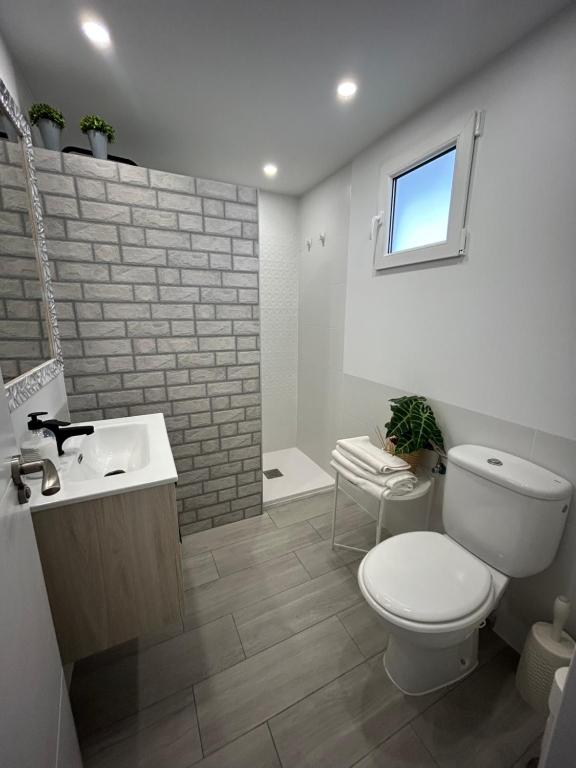 a bathroom with a toilet and a sink at Hernando II in Calpe