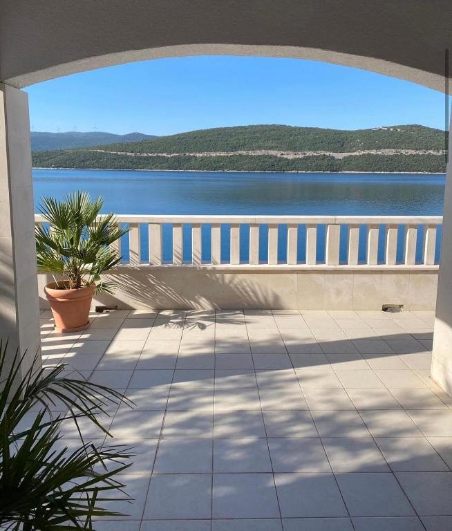 a balcony with a view of the water at Villa M in Neum