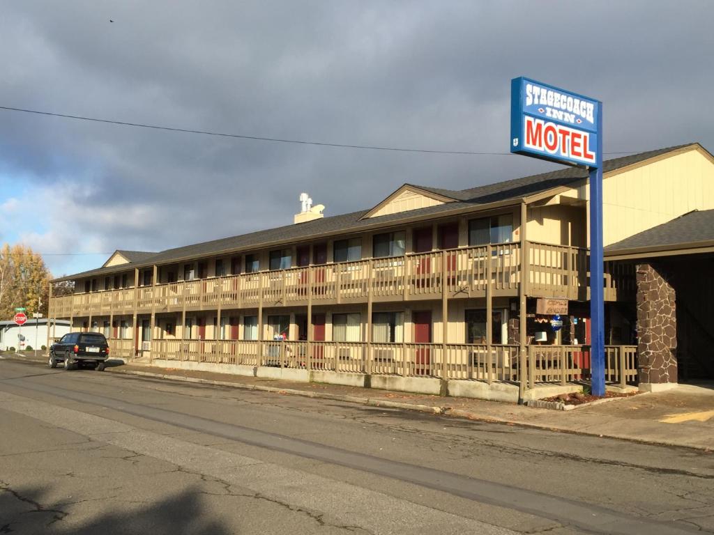 a motel building on the side of a street at Stagecoach Inn Motel in Molalla