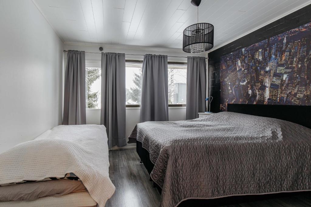 Postel nebo postele na pokoji v ubytování Heleenkatu 3 a 1 oma sauna autokatos omassa pihassa