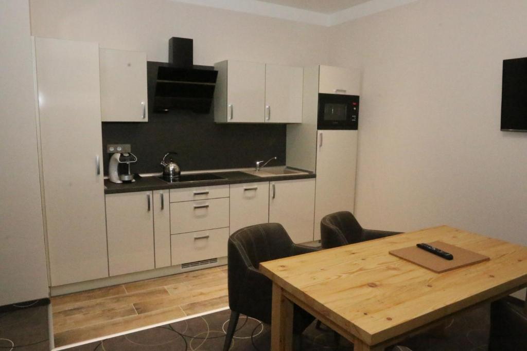 Kuchyň nebo kuchyňský kout v ubytování Apartment Hotel Orion