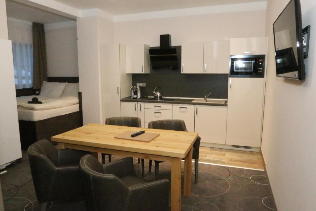 Kuchyň nebo kuchyňský kout v ubytování Apartment Hotel Orion