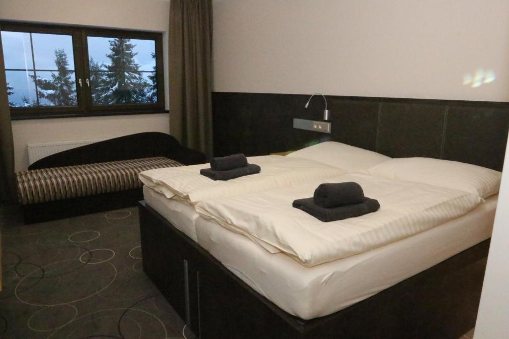 Postel nebo postele na pokoji v ubytování Apartment Hotel Orion