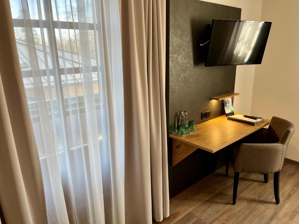 TV a/nebo společenská místnost v ubytování Hotel Oberwirt