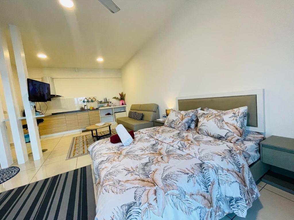 a bedroom with a bed and a living room at Evo Soho Bangi Star Luxury by Alina Homestay in Bandar Baru Bangi