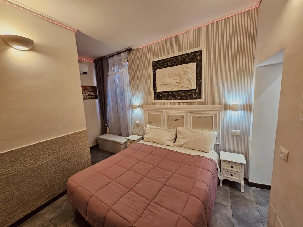 Postel nebo postele na pokoji v ubytování A&F Colosseo