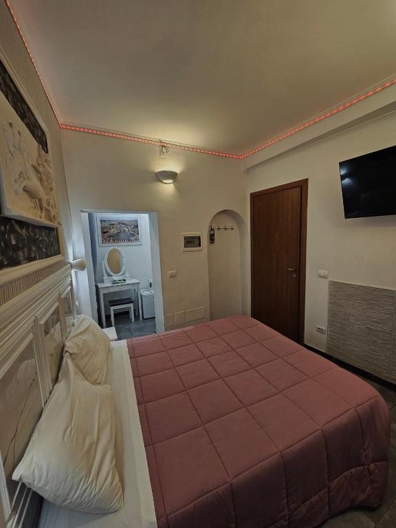 Postel nebo postele na pokoji v ubytování A&F Colosseo