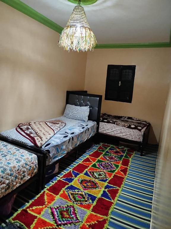 Postel nebo postele na pokoji v ubytování Gîte Assonfo Tachdirt
