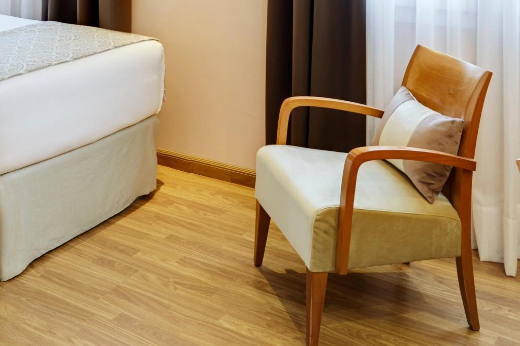 Cama o camas de una habitación en Sercotel Alcalá 611
