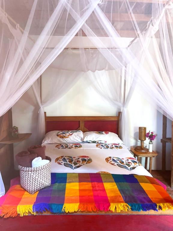 Postel nebo postele na pokoji v ubytování Hostal Olmito Canoa