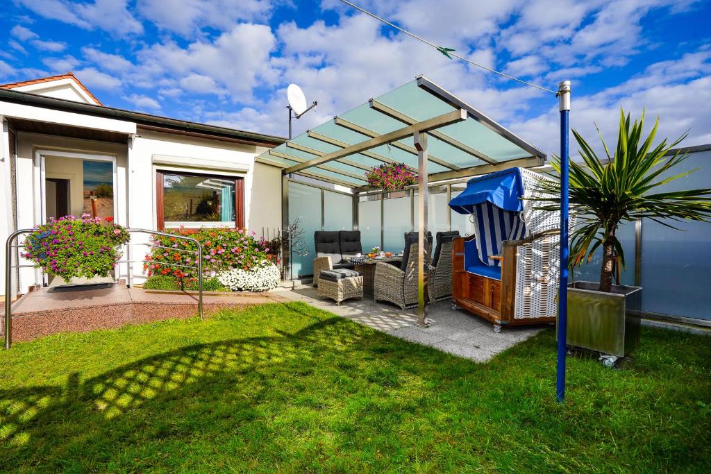 Κήπος έξω από το Haus Strandperle Bungalow