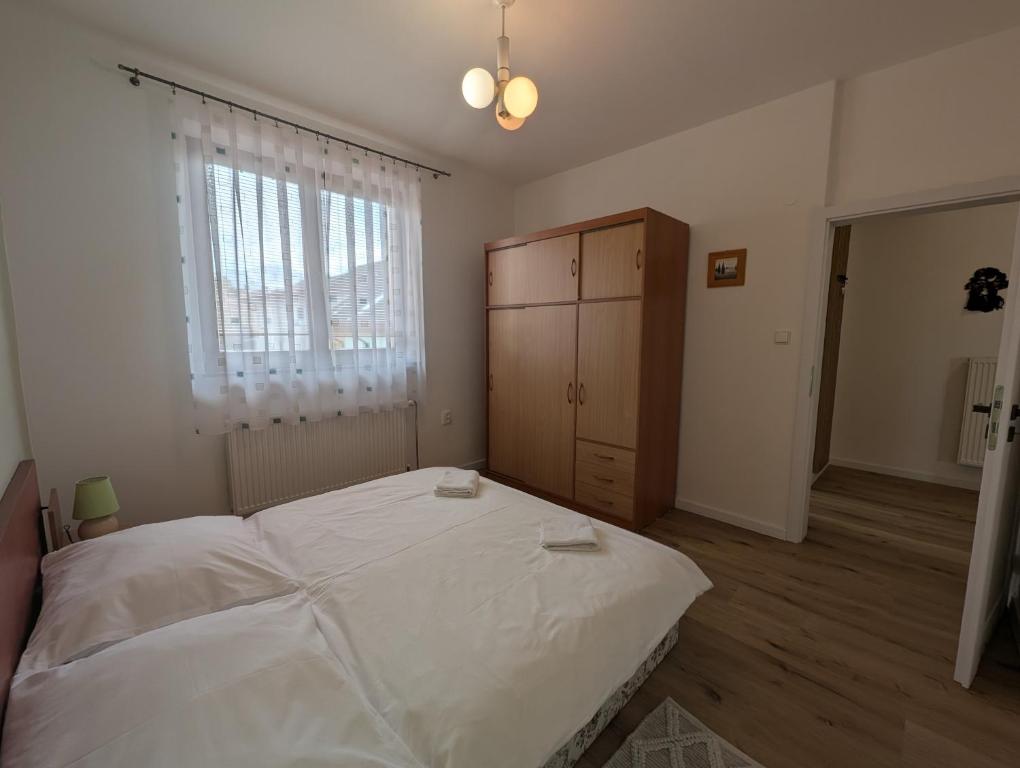 Postel nebo postele na pokoji v ubytování Apartmany u Denyho