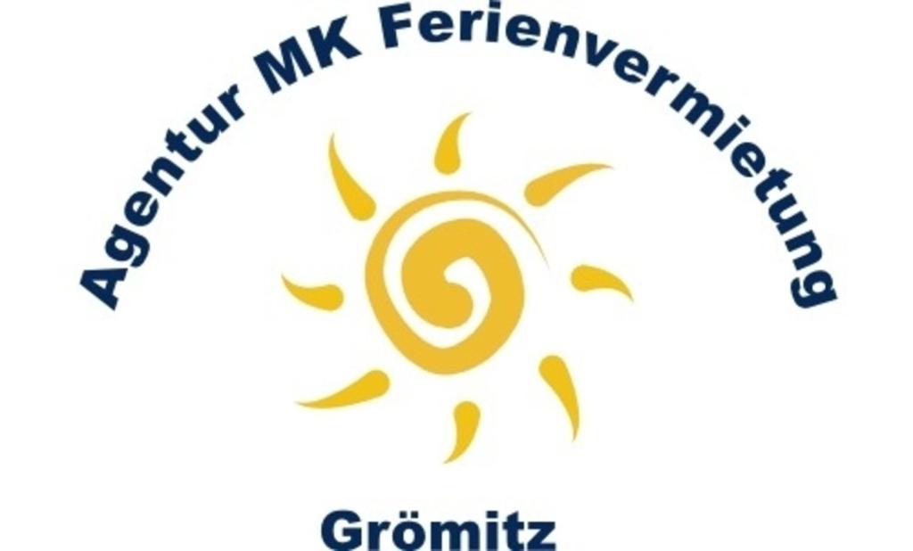 a logo of a spiral with the words quantum mix enrichment catalyst at See-Hase in Grömitz