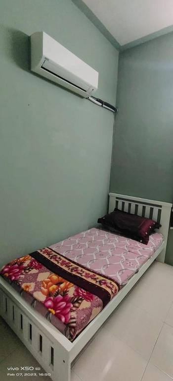 Katil atau katil-katil dalam bilik di Homestay Lumut Perak