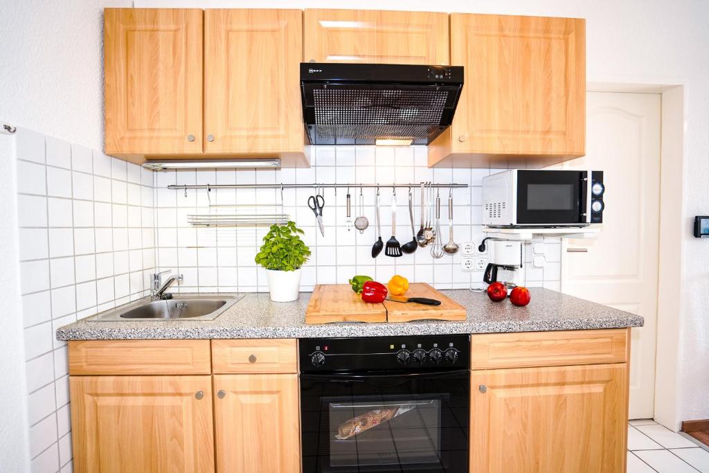 Kuchyň nebo kuchyňský kout v ubytování Gorch-Fock-Weg 11 Whg 2