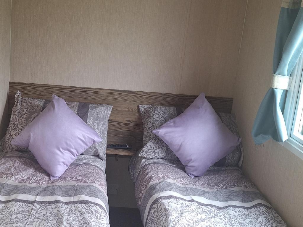Postel nebo postele na pokoji v ubytování Purple Jasper