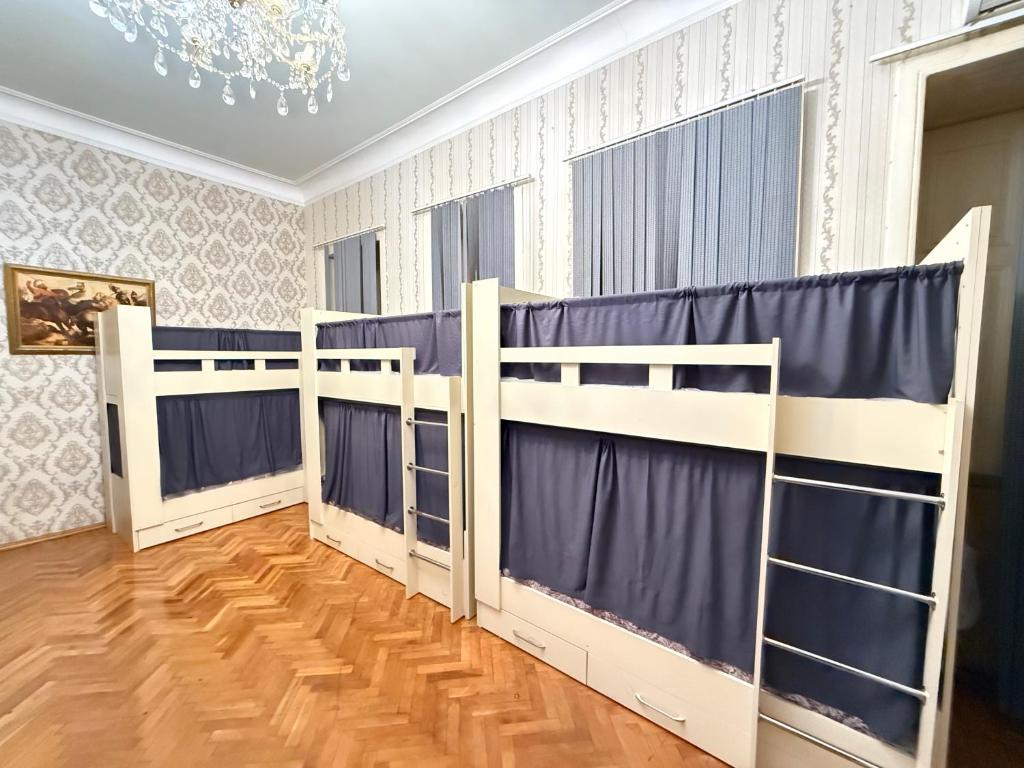 Postel nebo postele na pokoji v ubytování KM Hostel and Tourism