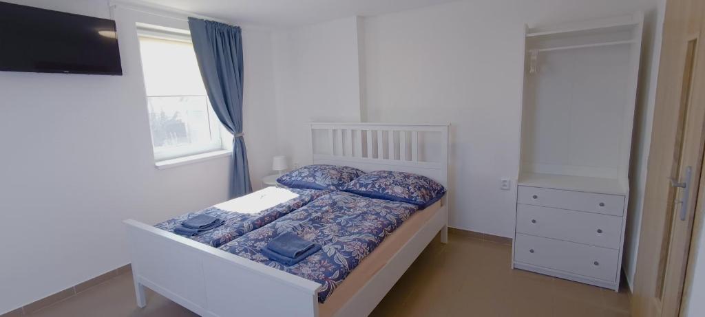Postel nebo postele na pokoji v ubytování Ubytování U Tajčů