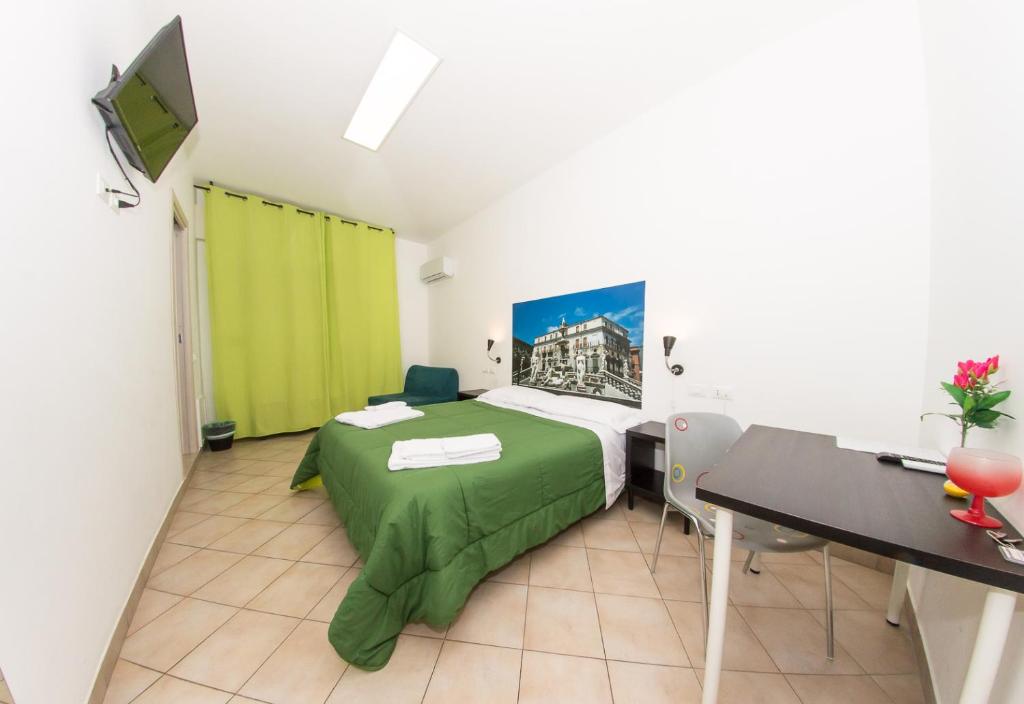Postel nebo postele na pokoji v ubytování B&B Into Palermo Rooms