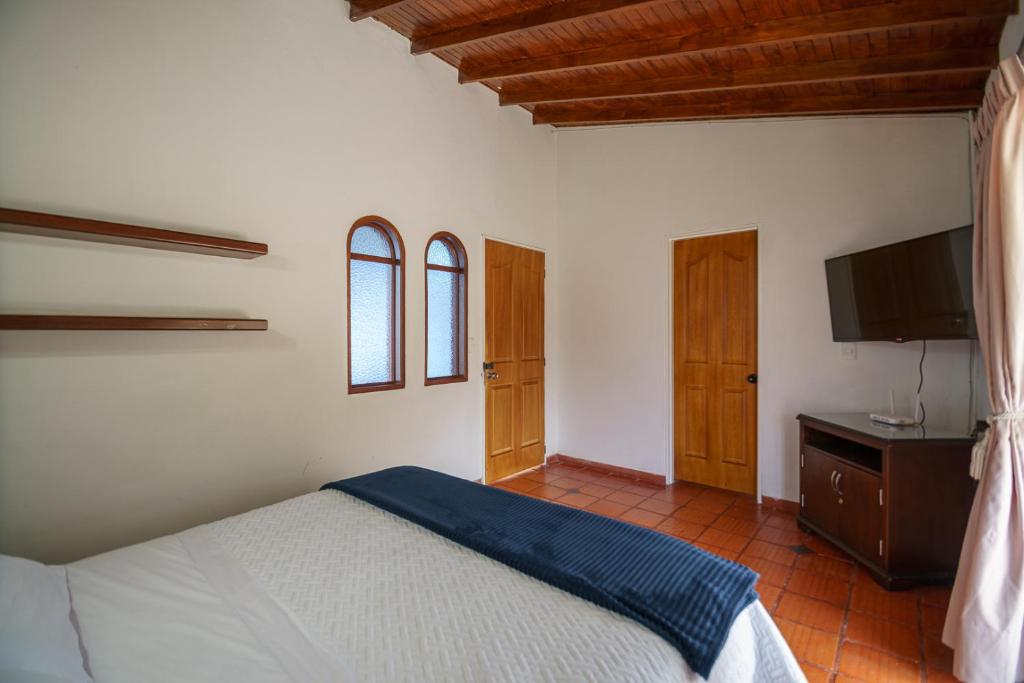 Postel nebo postele na pokoji v ubytování Finca Hotel 12 Palmas- Aeropuerto JMC