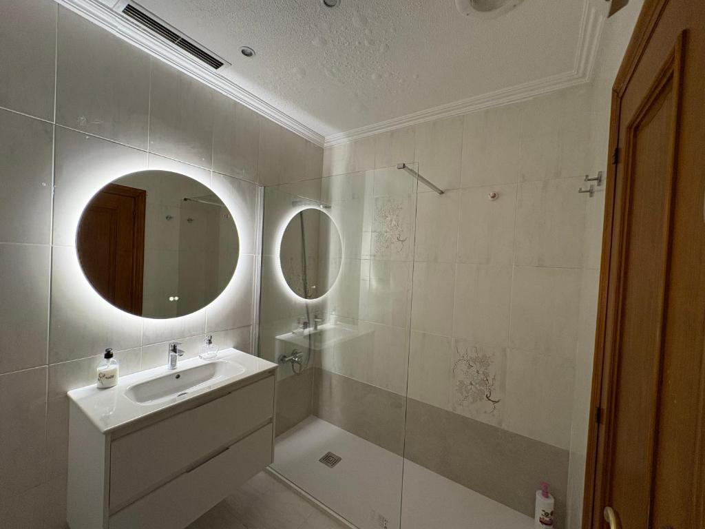 a bathroom with a sink and a mirror at Major del Pla 25 in Elche