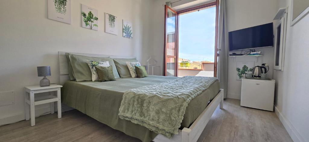 Posteľ alebo postele v izbe v ubytovaní Casa Rosy - Stanza privata con bagno esclusivo e parcheggio gratuito