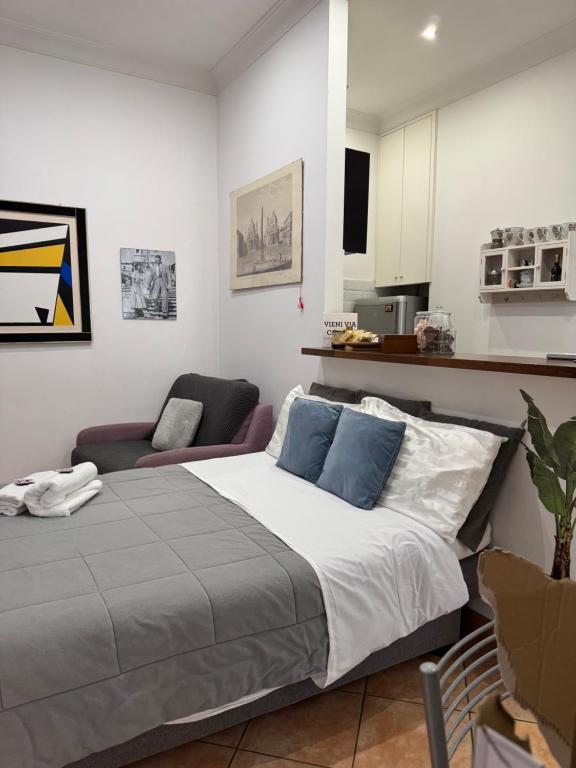 A bed or beds in a room at All Suite Colosseo