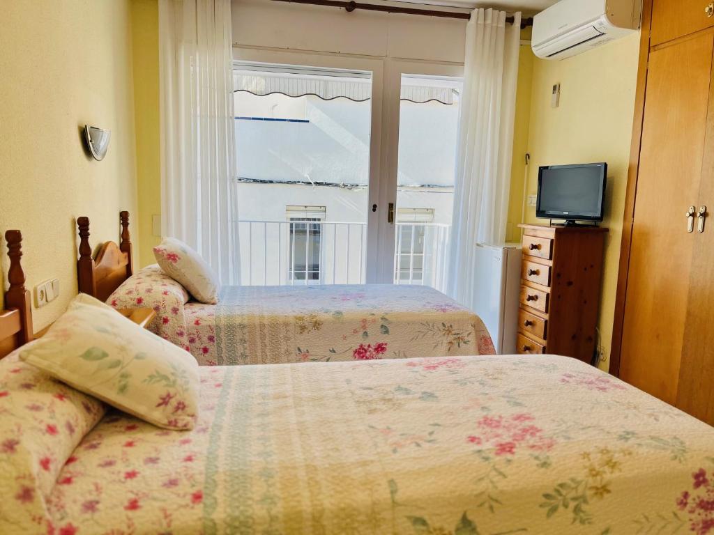 Postel nebo postele na pokoji v ubytování Habitacions La Font