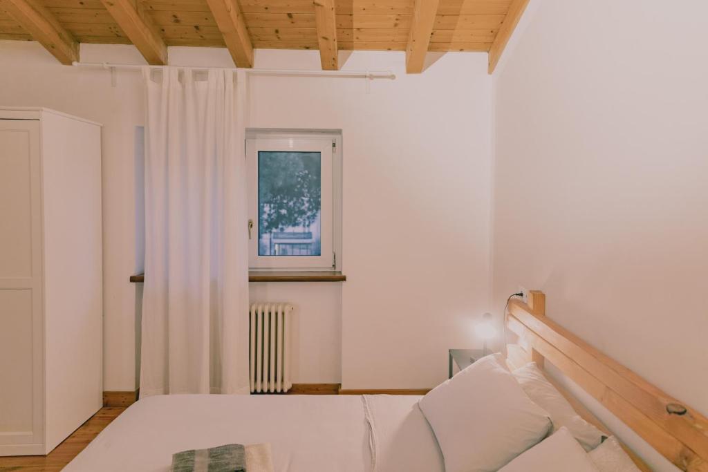 A bed or beds in a room at CA11 - Apartments