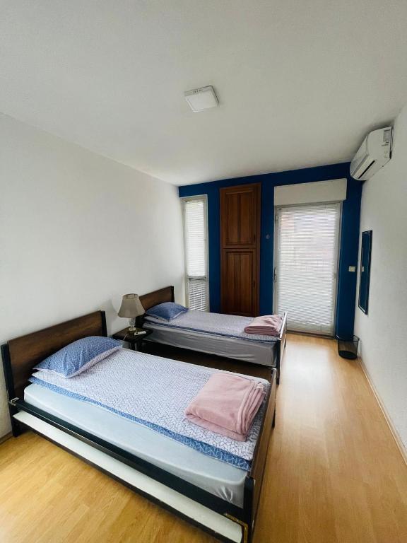 Postel nebo postele na pokoji v ubytování Sky Hostel